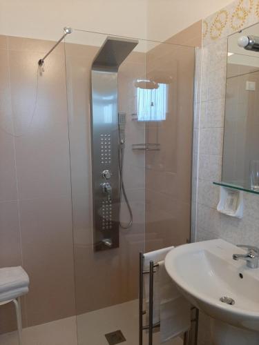 a bathroom with a shower and a sink at Residence Sole in Albenga