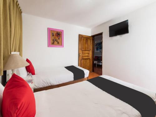 Cama o camas de una habitación en Suites Internacional