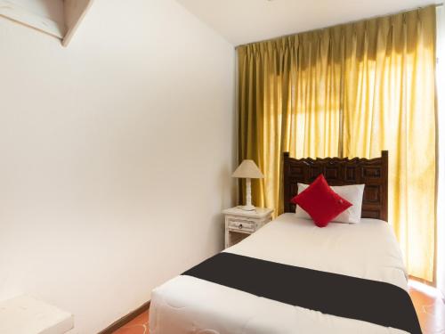 Cama o camas de una habitación en Suites Internacional