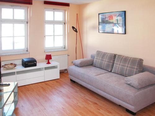 a living room with a couch and a table at Ferienwohnung Bernhardt in Zella-Mehlis