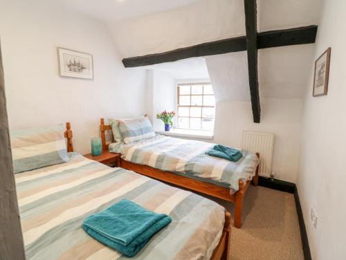 Postel nebo postele na pokoji v ubytování Teign Cottage
