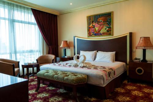 Vuode tai vuoteita majoituspaikassa Ewan Hotel Sharjah