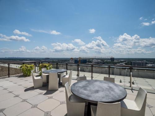 a patio with tables and chairs on a roof at Global Luxury Suites at Reston Town Center in Reston