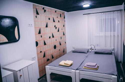 Säng eller sängar i ett rum på Smart Hostel