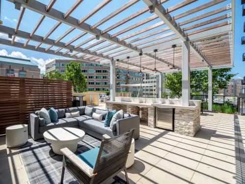 a patio with a couch and a table on a building at Global Luxury Suites at Reston Town Center in Reston