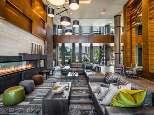 a living room with a couch and a fireplace at Global Luxury Suites at Reston Town Center in Reston