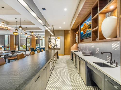 a kitchen with a sink and a counter top at Global Luxury Suites at Reston Town Center in Reston