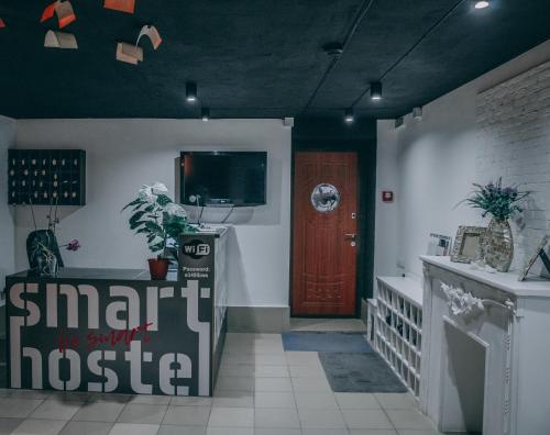a hallway with aoyer with a door and a tv at Smart Hostel in Odesa