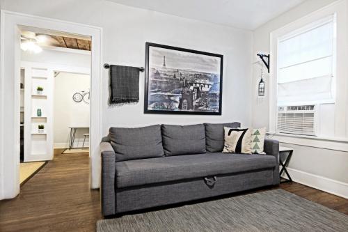 a living room with a couch and a window at Global Cup Urban Convenience Studio Flat in Dallas