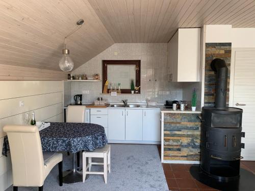 a kitchen with a table and a stove at Apartments Hana Bled in Bled