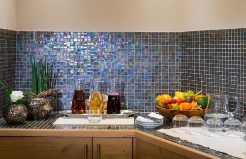 a kitchen counter with a bowl of fruit on it at Hotel Post in Kaltenbach