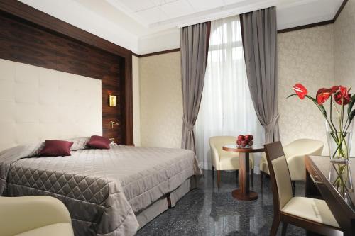 Ένα ή περισσότερα κρεβάτια σε δωμάτιο στο Hotel Ranieri