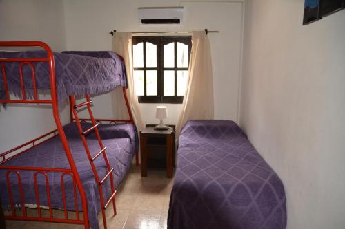 a room with two bunk beds and a window at Hospedaje Iruya Mi Pueblo in Iruya