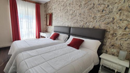 Postelja oz. postelje v sobi nastanitve Hotel Prados