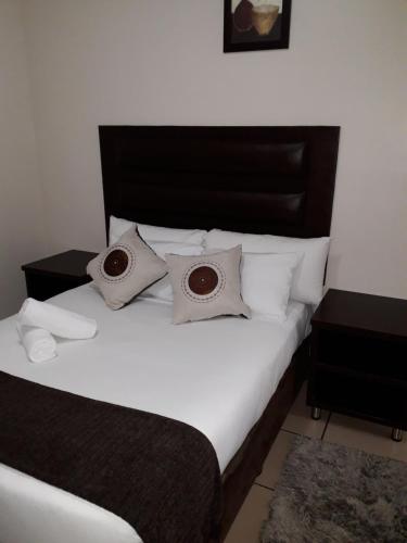 Letto o letti in una camera di Bayside Hotel Empangeni