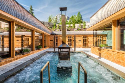 a swimming pool in the middle of a house at Caravan Park Sexten in Sesto