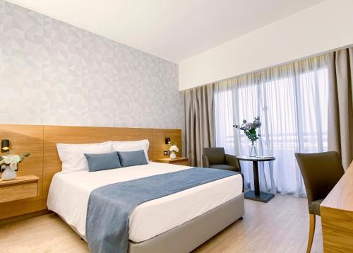 Voodi või voodid majutusasutuse Ajax Hotel toas