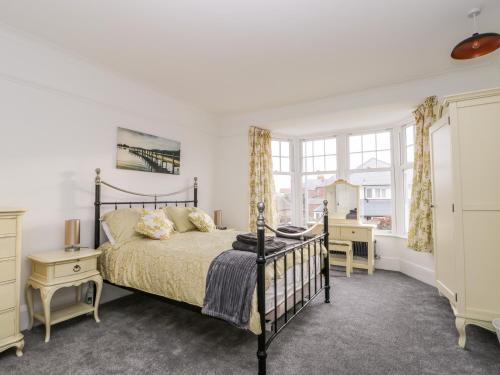 a bedroom with a bed and a window at Beach House in Bridlington