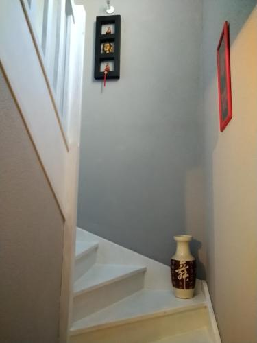 a stairway with white steps and a window at Chambre in Carcassonne