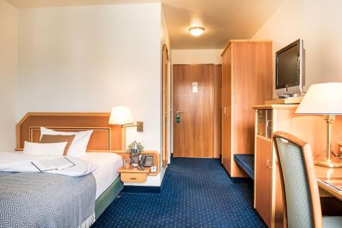 Ένα ή περισσότερα κρεβάτια σε δωμάτιο στο Sunderland Hotel