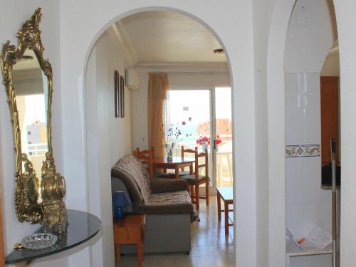 an archway in a living room with a dining room at Apartment Agua Viva by Interhome in Cala de Finestrat