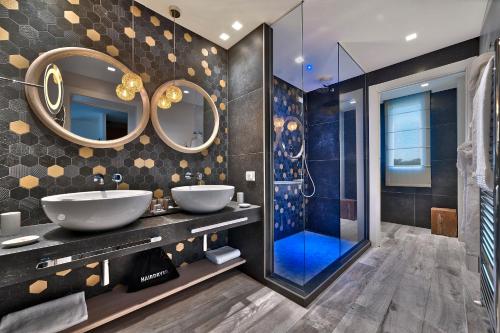 a bathroom with two sinks and a shower at Esplanade Tergesteo - Luxury Retreat in Montegrotto Terme