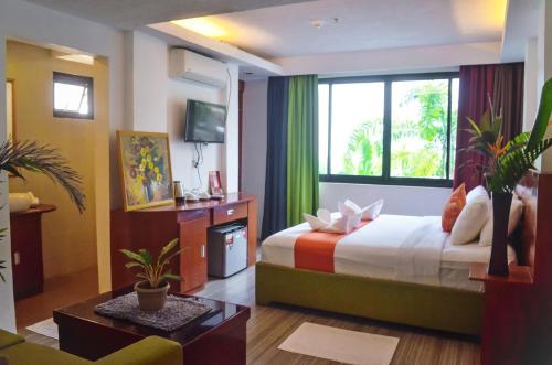 a hotel room with a bed and a window at Villa Israel Ecopark El Nido in El Nido