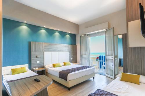 En eller flere senge i et værelse på Hotel Internazionale