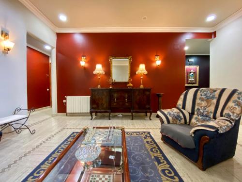 a living room with a couch and a table at Hostal Bonavista in Cervera