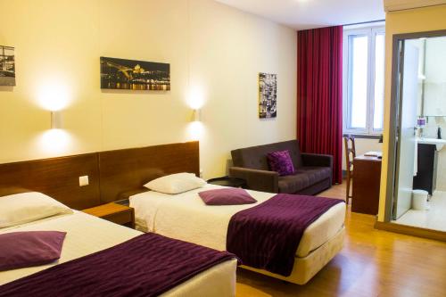 מיטה או מיטות בחדר ב-Hotel Estoril Porto