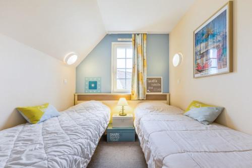 Ένα ή περισσότερα κρεβάτια σε δωμάτιο στο Residence Belle Dune - maeva Home