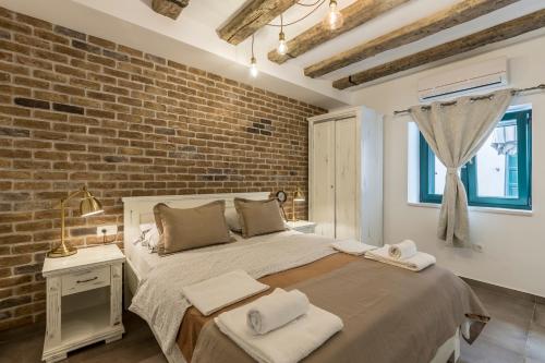 Posteľ alebo postele v izbe v ubytovaní Studio Apartments Insula