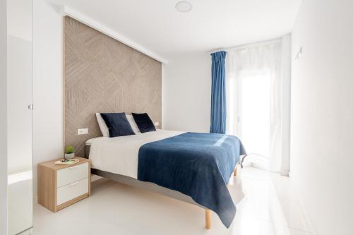 מיטה או מיטות בחדר ב-Santa Pola Apartments