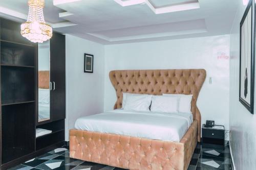a bedroom with a large bed in a room at 247 Luxury Hotel in Lekki