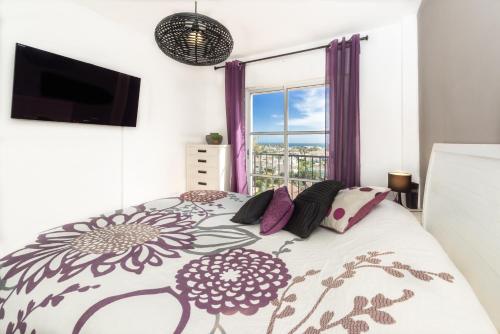 A bed or beds in a room at ATICO MIJAS COSTA