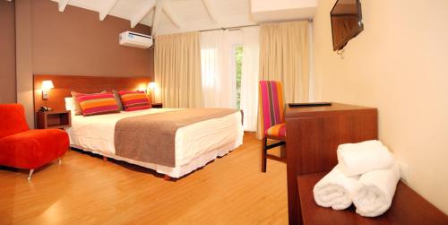 Una cama o camas en una habitación de Berna Hotel & Spa