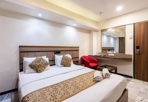 Voodi või voodid majutusasutuse Hotel Avon Ruby Dadar toas