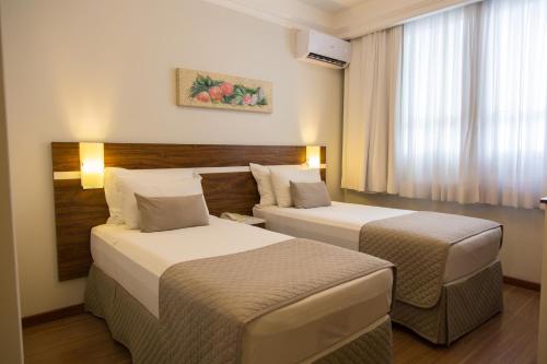 Postel nebo postele na pokoji v ubytování Hotel Princess