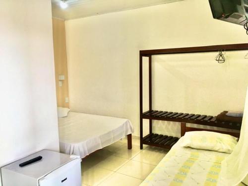 Postel nebo postele na pokoji v ubytování Hotel Pousada Hamburgo