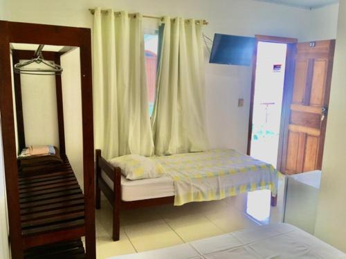 Postel nebo postele na pokoji v ubytování Hotel Pousada Hamburgo
