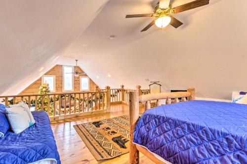 a bedroom with a bed and a balcony at Quaint Creston Hideaway with Mtn Views and Hot Tub! in Creston