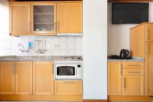 Η κουζίνα ή μικρή κουζίνα στο Muthu Oura Praia Hotel