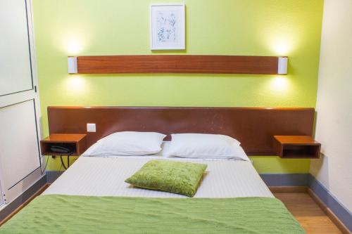 Ένα ή περισσότερα κρεβάτια σε δωμάτιο στο Hotel Estoril Porto