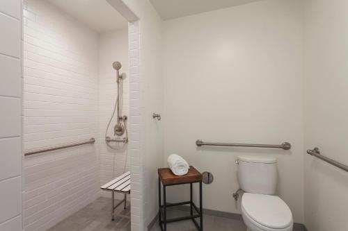 a bathroom with a toilet and a shower at La Playa Inn Santa Barbara in Santa Barbara