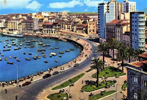 a view of a city with boats in a harbor at ALBOR II in Gijón