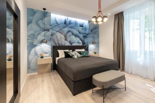 a bedroom with a bed and a wall mural at Sweet Dreams-Old Town in Split