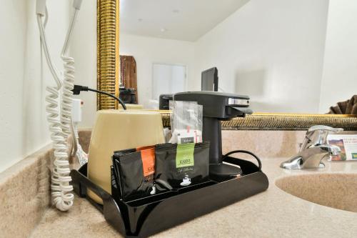 a cash register sitting on top of a counter at Adventure Inn Moab in Moab