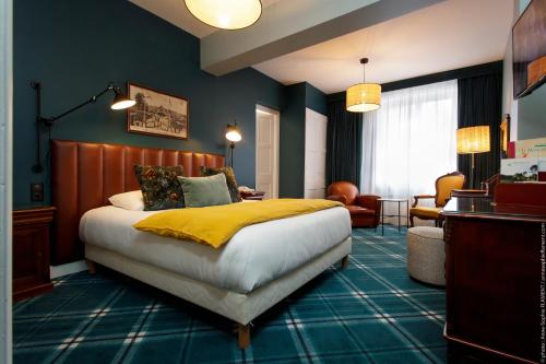 Katil atau katil-katil dalam bilik di Le Manoir Hôtel