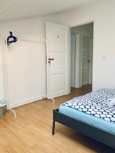 Ένα ή περισσότερα κρεβάτια σε δωμάτιο στο Restelo House Shared Appartment