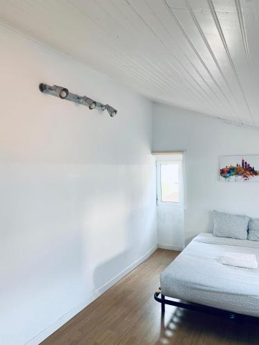 Ένα ή περισσότερα κρεβάτια σε δωμάτιο στο Restelo House Shared Appartment